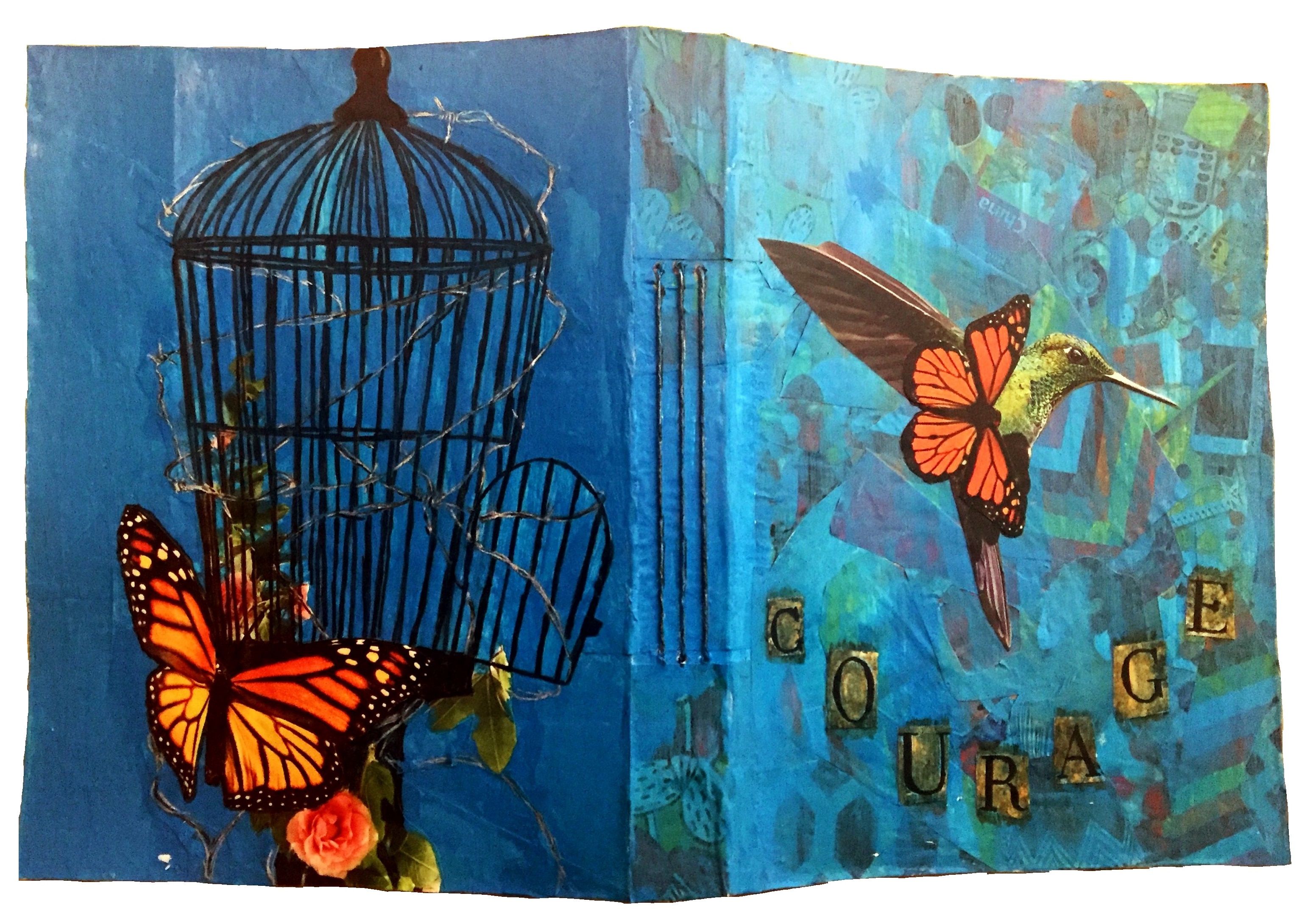 A customized art journal I was commissioned to make with butterflies and a hummingbird escaping from a barbed wire cage with the word courage on the front; I created the journal with a cereal box, collage material, scrap paper, acrylic paint, and ink.