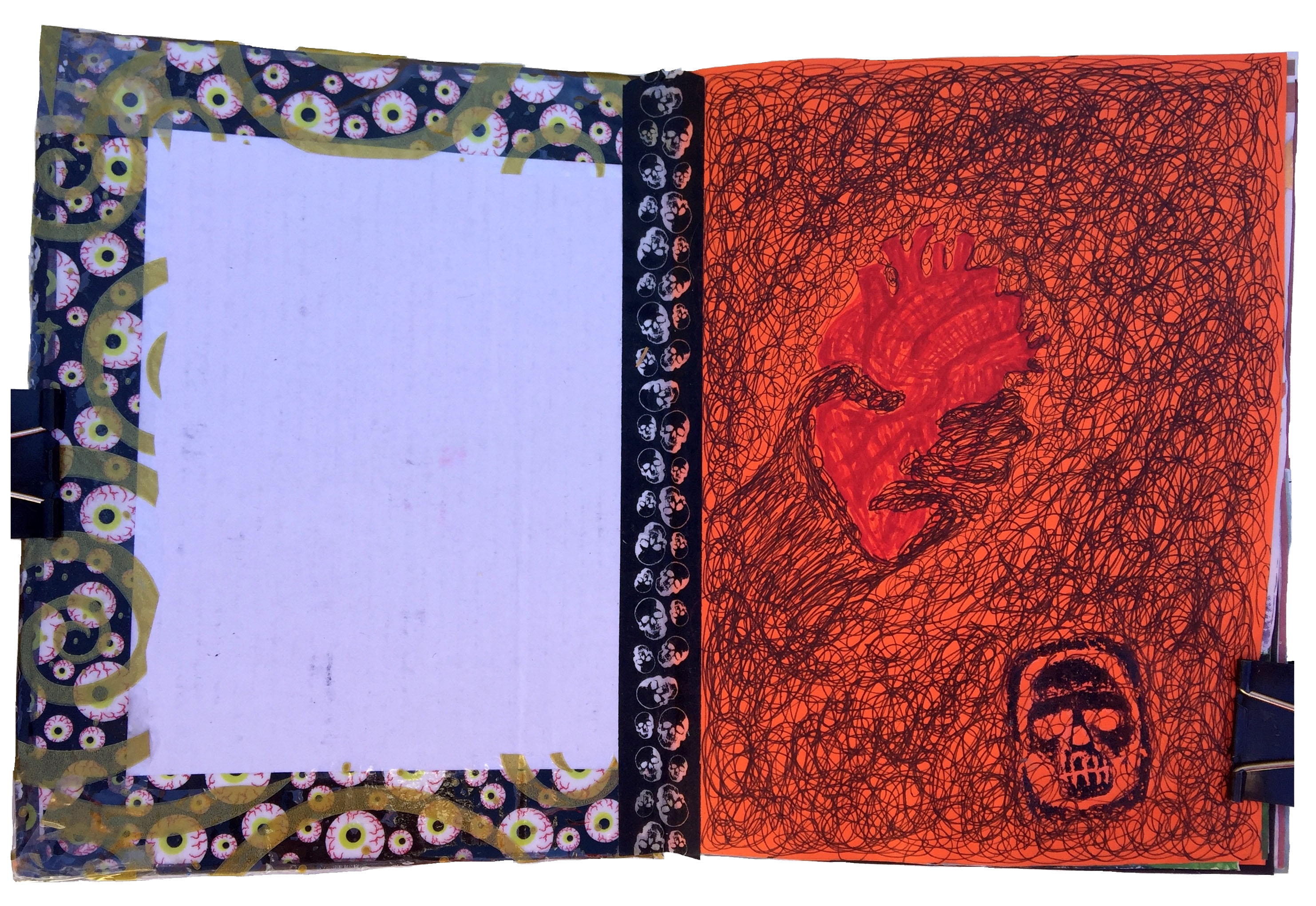 A scribbled inky art journal page with an anatomical heart and a skull temporary tattoo.