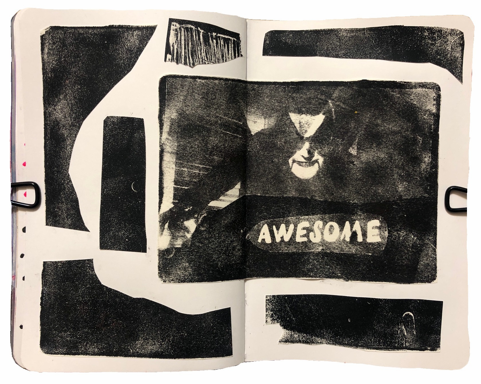 A mixed media art journal page with monoprinting experiments using a gel plate with an image transfer of the musician Abbath.