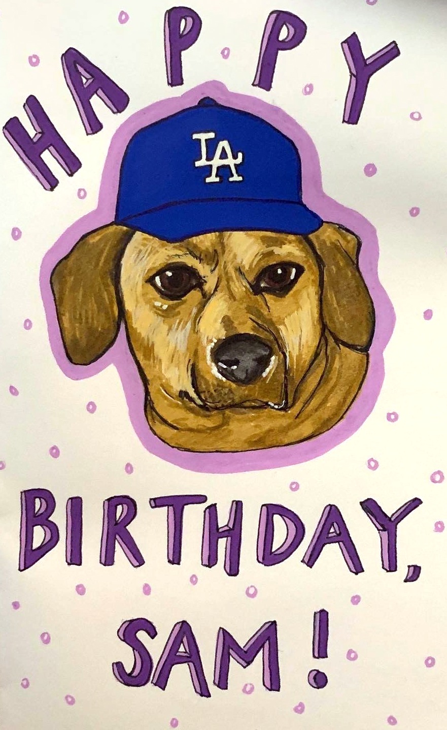 A birthday card I made for a colleague with a drawing of her Dachshund wearing a LA Dodgers baseball hat, I created the card with acrylic markers and ink.