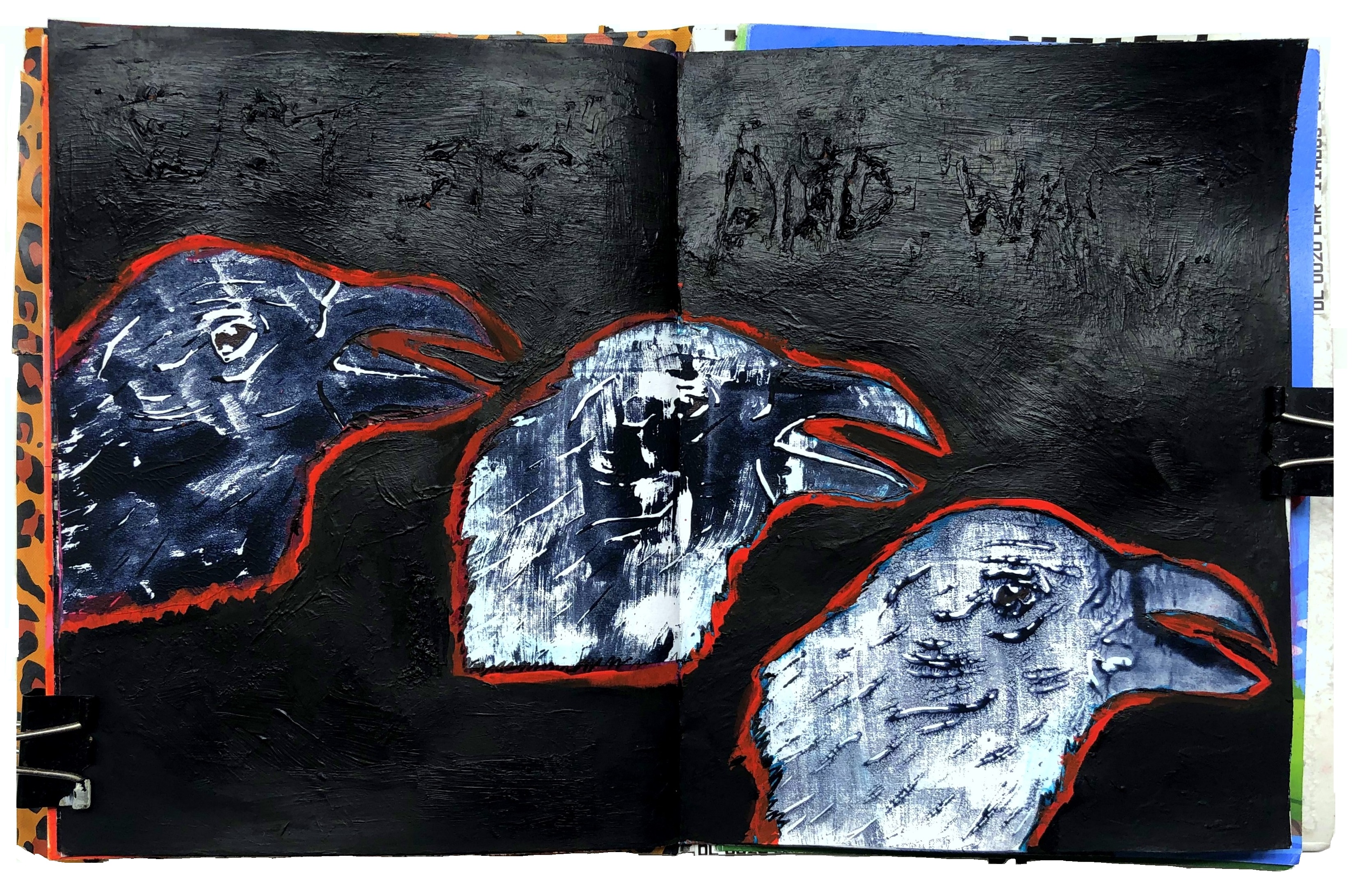 A mixed media art journal lino print of three crows.