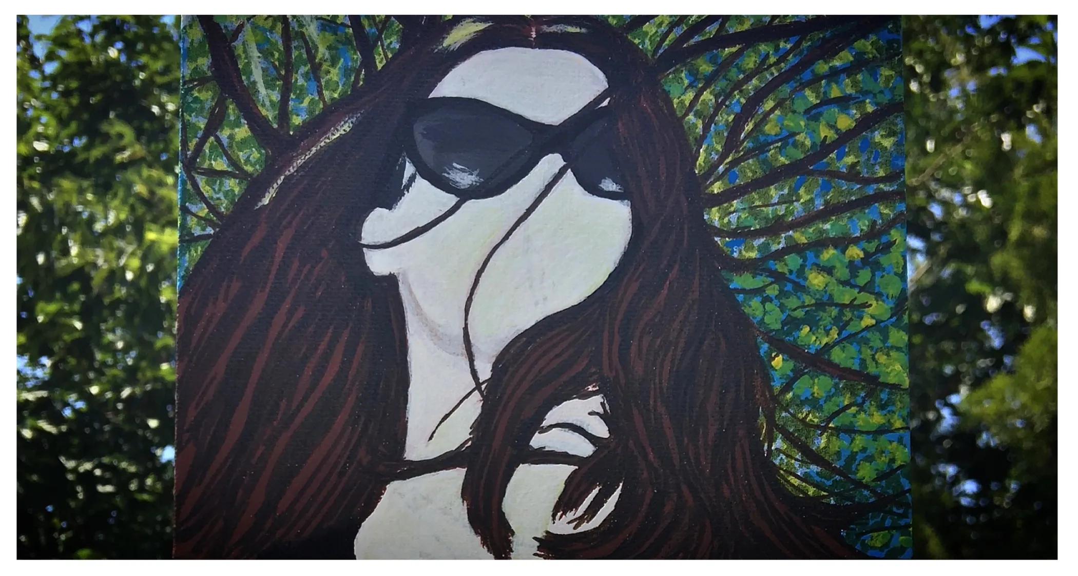 A canvas painting of myself wearing sunglasses in sunny Los Angeles under a leafy tree; I created the piece with acrylic paint.
