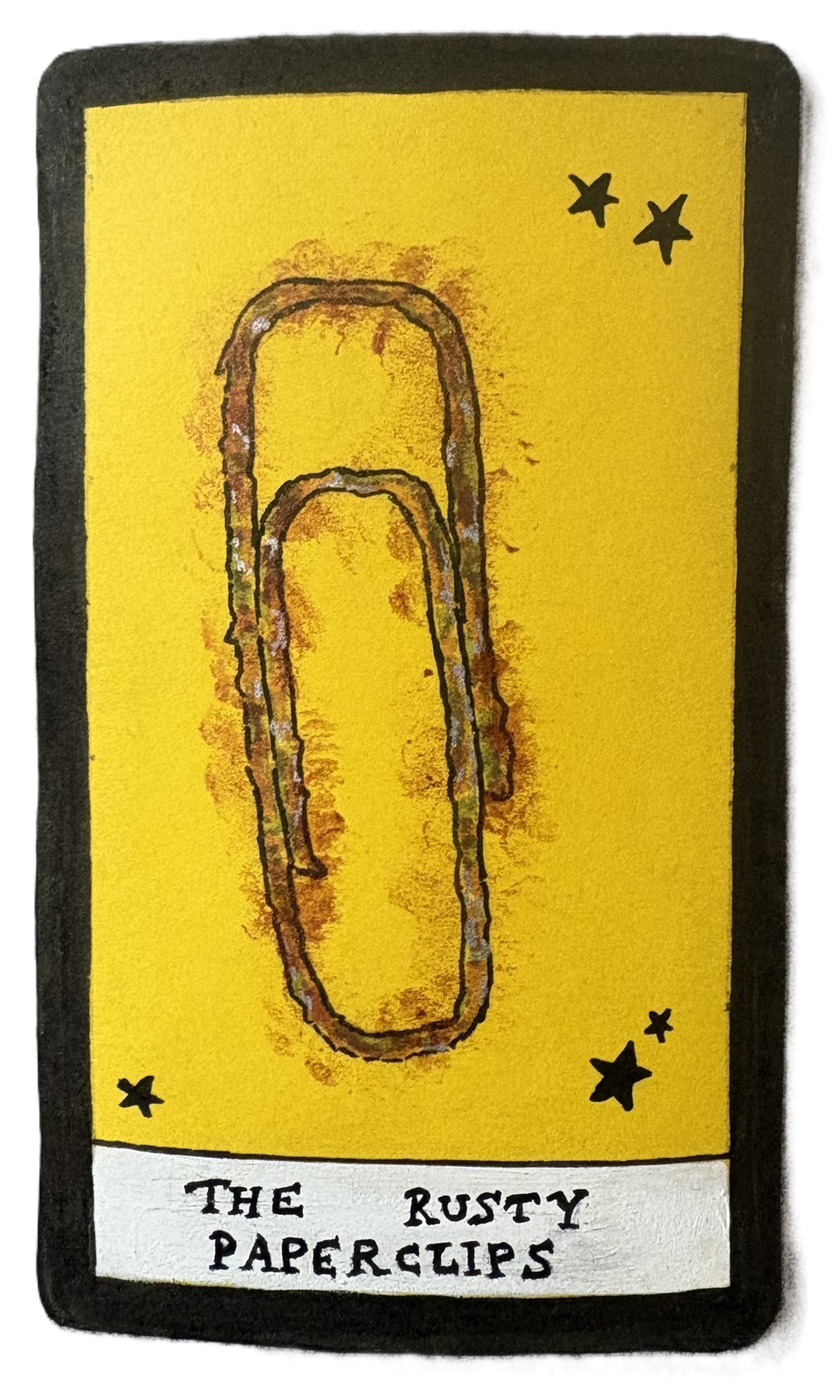 The Rusty Paperclips with a drawing of a rusty paperclip.