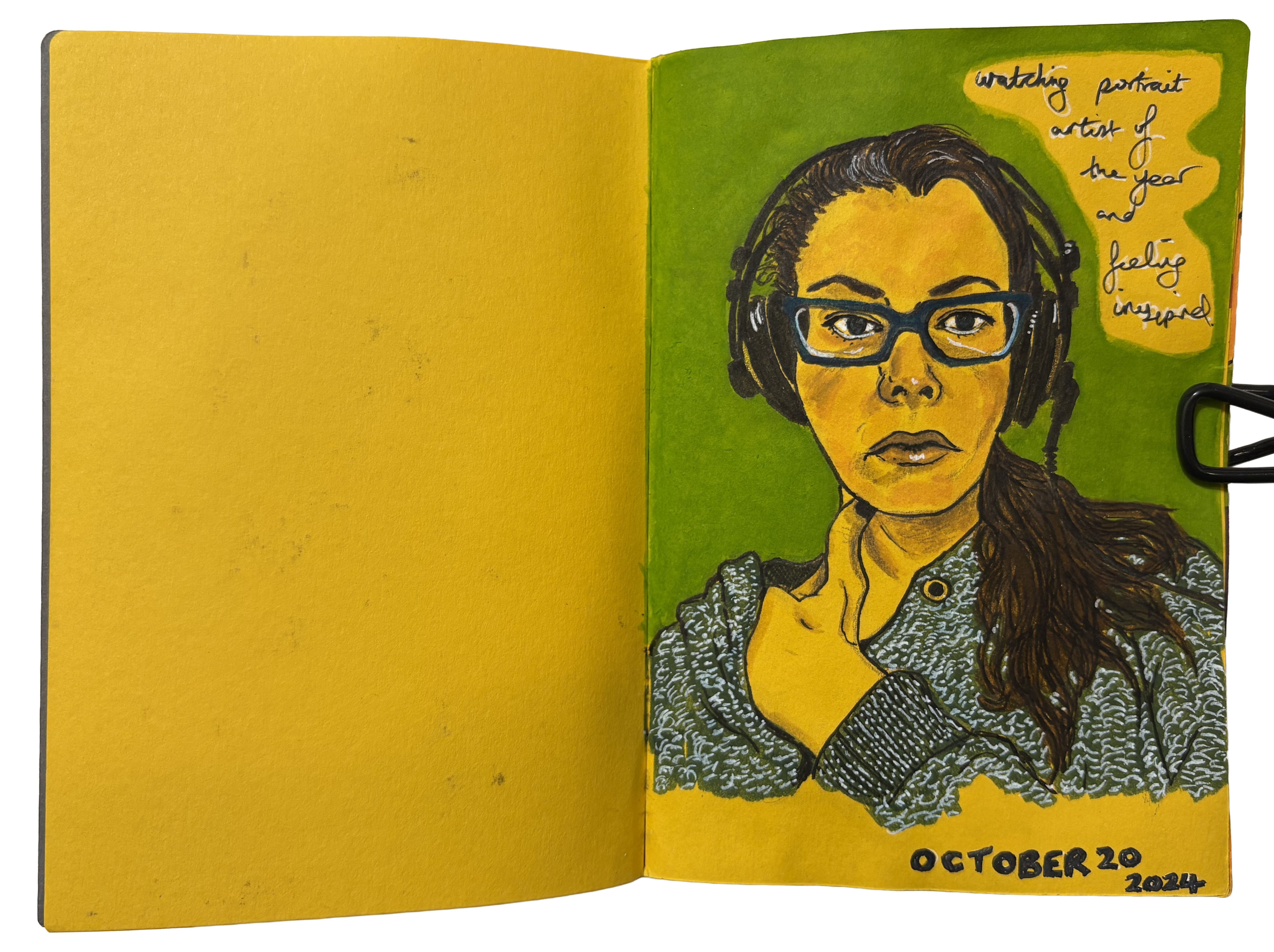 Illustrated self-portrait art journal page showing the artist wearing a grey hoodie, blue glasses, and headphones. Handwritten text beside the portrait reads, "watching Portrait Artist of the Year and feeling inspired." The artwork is created in ink.
